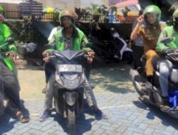 Camat Tallo Alamsyah Bersama Sekcam Nimrod Kompak Naik Ojol ke Kantor